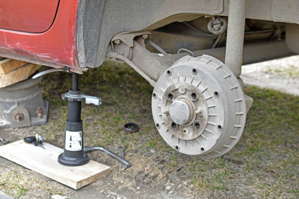 istock Mounting the wheel at the red car 1314345172