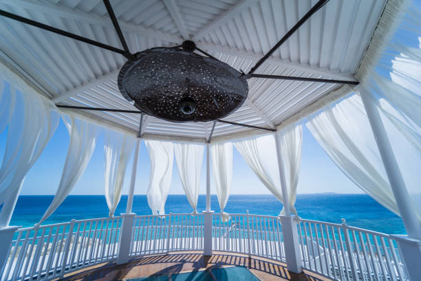 istock Romantic gazebo on the beach with blue sea 1314345804