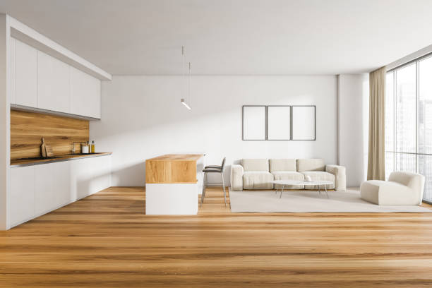 istock White sofa in light living room interior with kitchen and three posters 1314345997