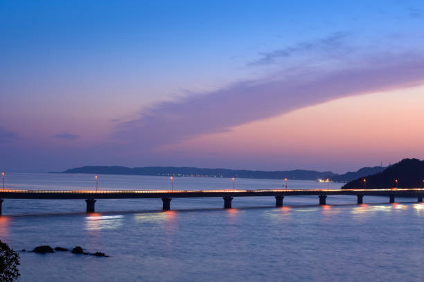 istock Tsunoshima Bridge and Tsunoshima surrounded by a beautiful orange sunset 1314347201