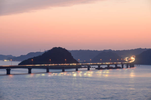 istock Tsunoshima Bridge and Tsunoshima surrounded by a beautiful orange sunset 1314347228