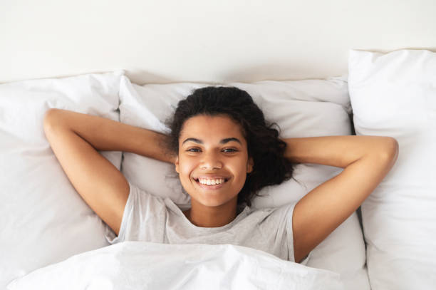 istock Young mixed-race woman lying down in bed 1314348715