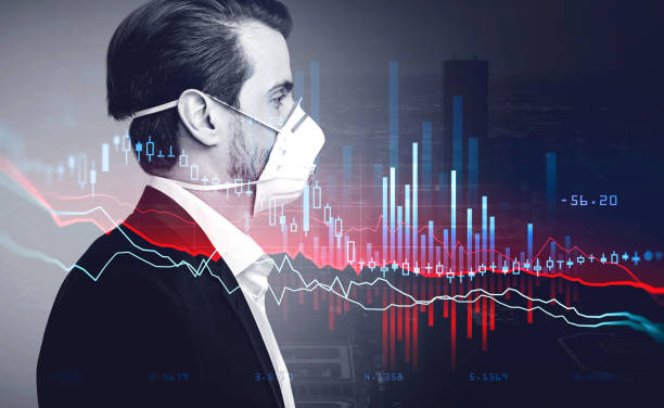 istock Businessman in respiratory mask, double exposure of graph falling 1314348733