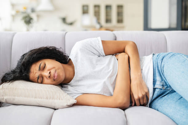 istock Depressed young African American girl lying down 1314348892