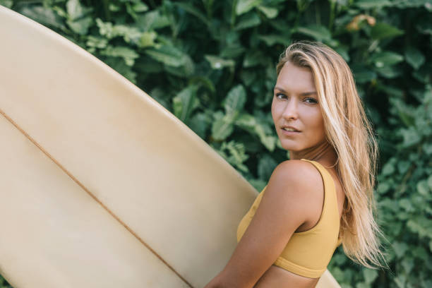 istock Beautiful woman surfer 1314350603