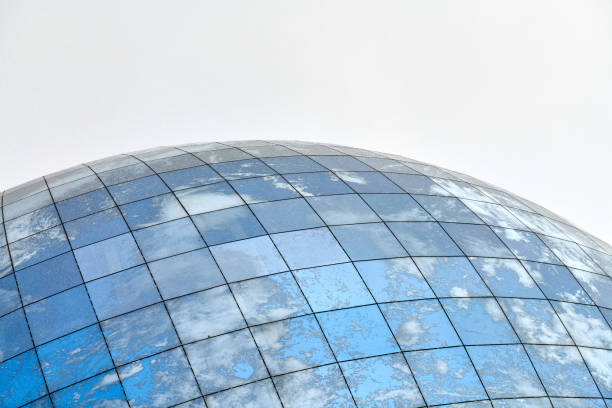 istock Glass spherical modern building with reflection of blue sky 1314351058