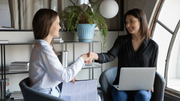 istock Grateful indian female employee appreciating teammate for help with paperwork 1314352180