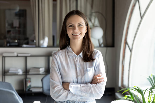 istock Motivated young lady employee standing at office looking at camera 1314352228