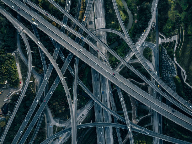 istock Aerial View of Complex Overpass and Busy Traffic 1314353541