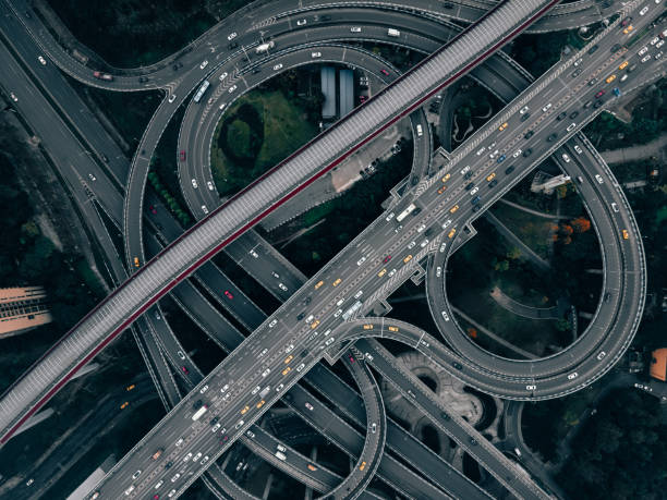 istock Aerial View of Complex Overpass and Busy Traffic 1314353684