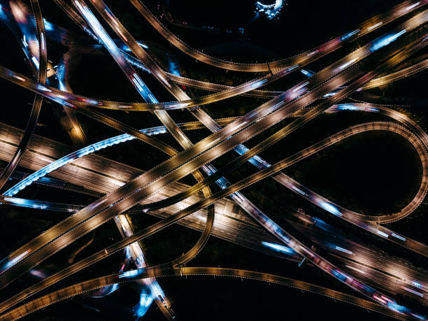 istock Aerial View of Complex Overpass and Busy Traffic at Night 1314353752