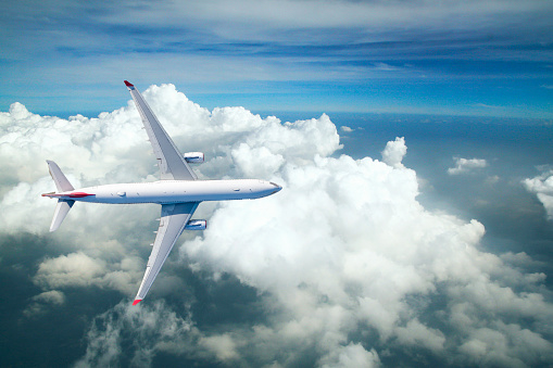 Airplane in the sky. Copy space of business summer vacation and travel adventure concept. Airplane sky and sunshine