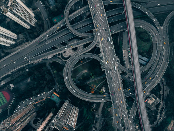 istock Aerial View of Complex Overpass and Busy Traffic 1314353903