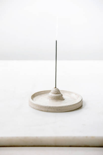 istock Fuming incense stick in craft ceramic holder 1314353994