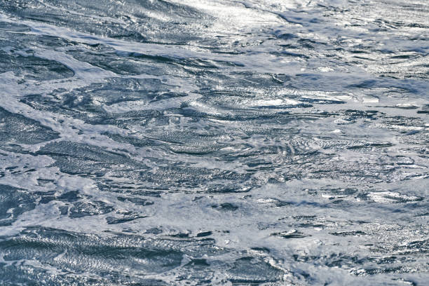 istock Dark foaming waves of stormy sea, background 1314357899