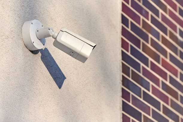 istock IP CCTV security camera on concrete wall, urban cityscape 1314357972
