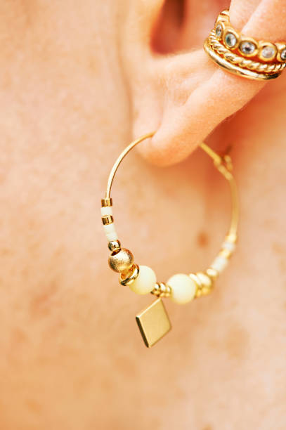 istock Close up image of female ear wearing modern earring 1314358537