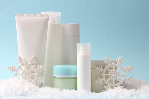 istock Winter care cosmetics on a colored background top view. 1314359532
