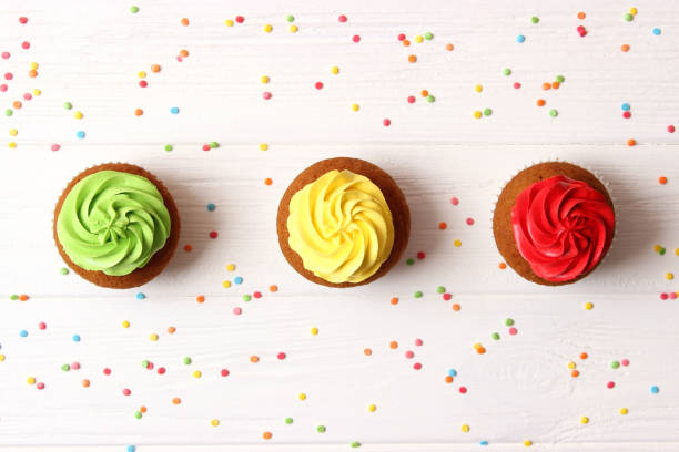 istock tasty cupcakes on a white background. 1314360088