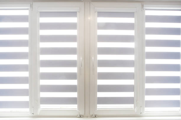 istock Windows with open modern horizontal blinds indoors, closeup 1314360835