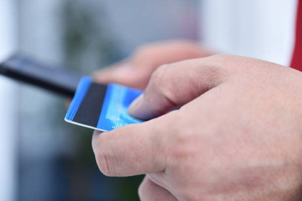 istock Man paying with credit card 1314361024