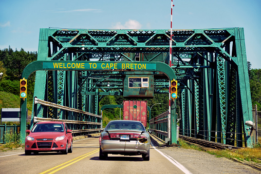 Canso, Canada - July 30, 2014: Sign on Canso Causeway welcoming people to Cape Breton the island in northern Nova Scotia, Canada