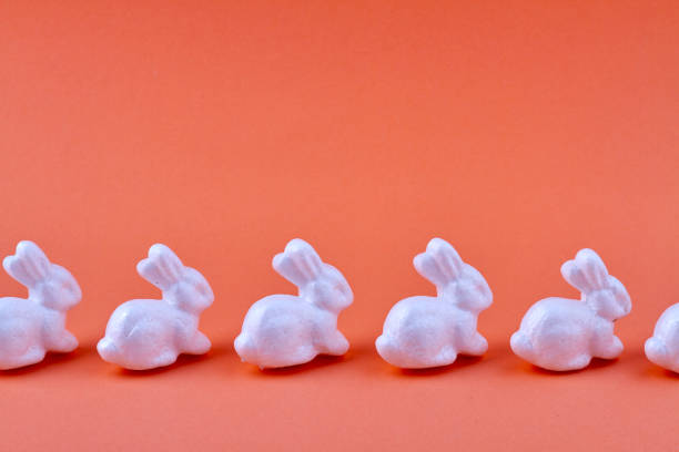 Easter ceramic rabbit on wooden background one