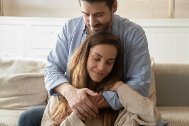 istock Young Caucasian couple hugging cuddling at home 1314362454
