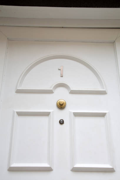 istock Close-up of Number One on White Front Door 1314362540