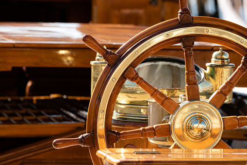 Up close view of the helm and rigging on an old classic wooden sailboat, Saint Tropez, France