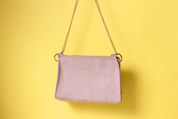 istock women bag in hand on a colored background 1314367436