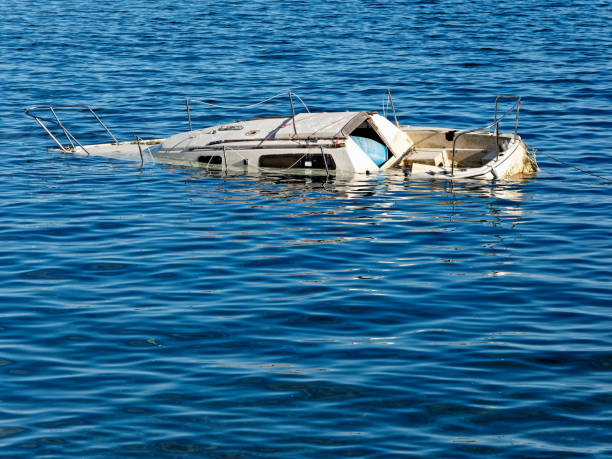 istock Sunken boat floats in the coastal waters 1314368661