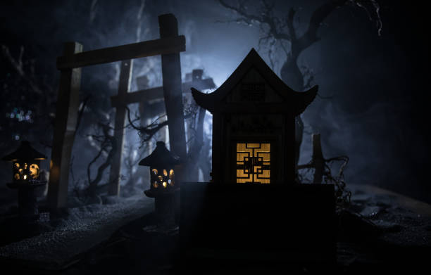 istock Creative artwork decoration. Abstract Japanese style wooden tunnel at night. Selective focus 1314370966