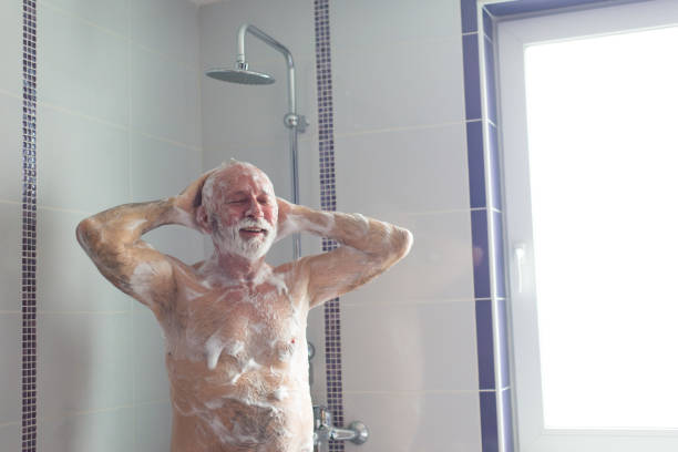 istock Senior man showering in the morning 1314371127