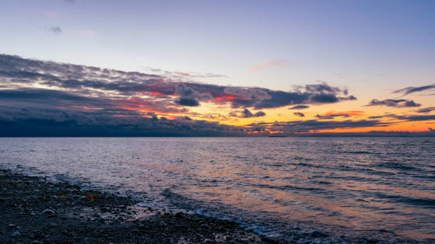 istock Whidbey Island sunset over Admiralty Inlet 1314371490