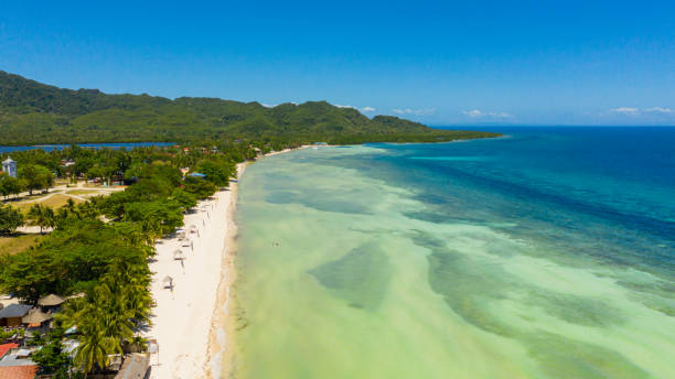 istock Coast with a beach and blue sea. Anda Bohol, Philippines 1314372901