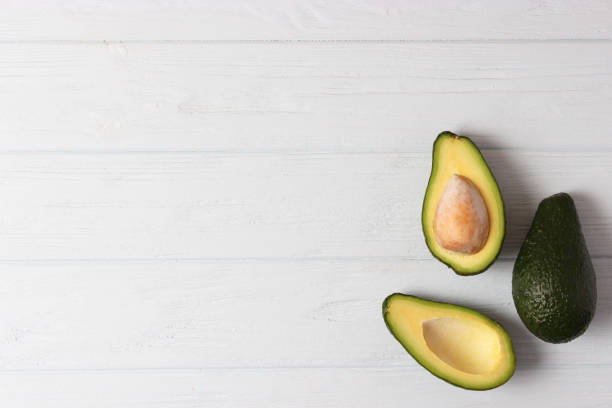 istock Avocado close-up on a colored background 1314374144