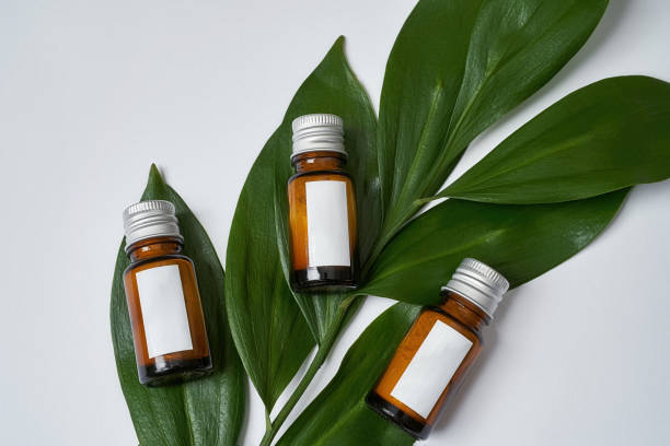 istock Cosmetological powder in glass bottles lying on green leaf 1314374521