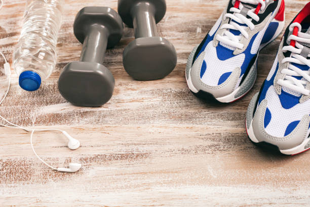 istock Sport equipment on wooden background. 1314374537