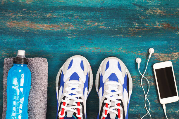 istock Sport equipment on wooden background. 1314374681