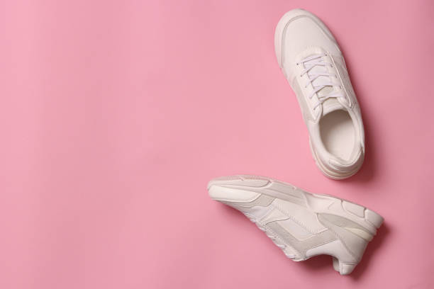 istock women's sneakers on a colored background top view. Women's shoes. 1314375526