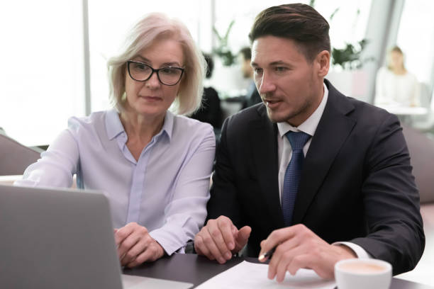 istock Diverse employees work on laptop discuss business ideas 1314375762