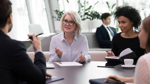 istock Multiracial colleagues brainstorm at team meeting in office 1314375779