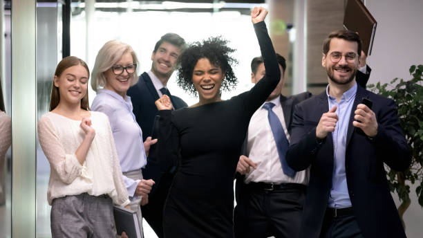 istock Smiling multiracial employees dance celebrate in office 1314375810