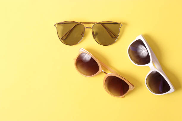 istock set of sunglasses on a colored background top view. 1314376147