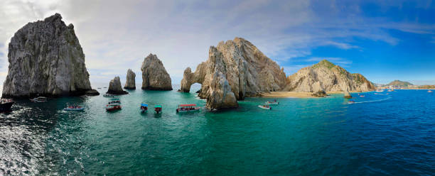 The Panorama Arch Panoramic shot of El Arco and the rocky coastline of Cabo San Lucas, Mexico cruise vacation photos stock pictures, royalty-free photos & images