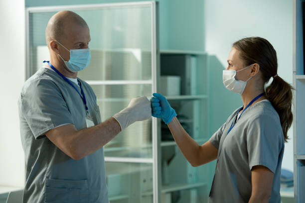 istock Surgeon making fist bump with assistant 1314377183