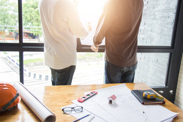 istock Engineering team consulting and analyzing the high-rise building projects in the city. 1314377276