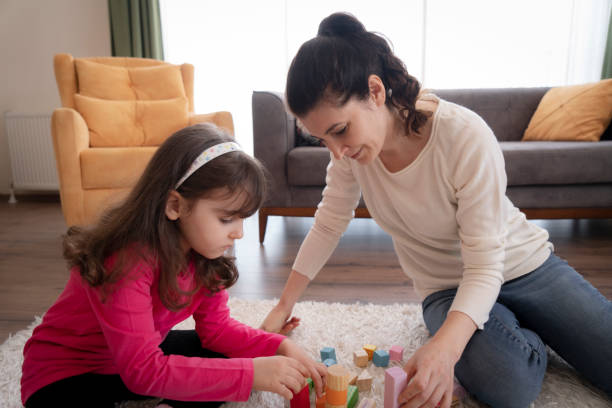 istock Mother and Daughter playing together 1314378092