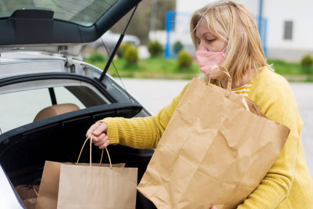 istock Woman holding paper bag 1314378436